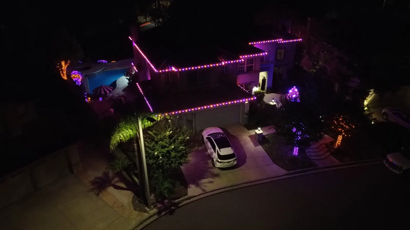 Aerial view of a Halloween roofline lighting installation
